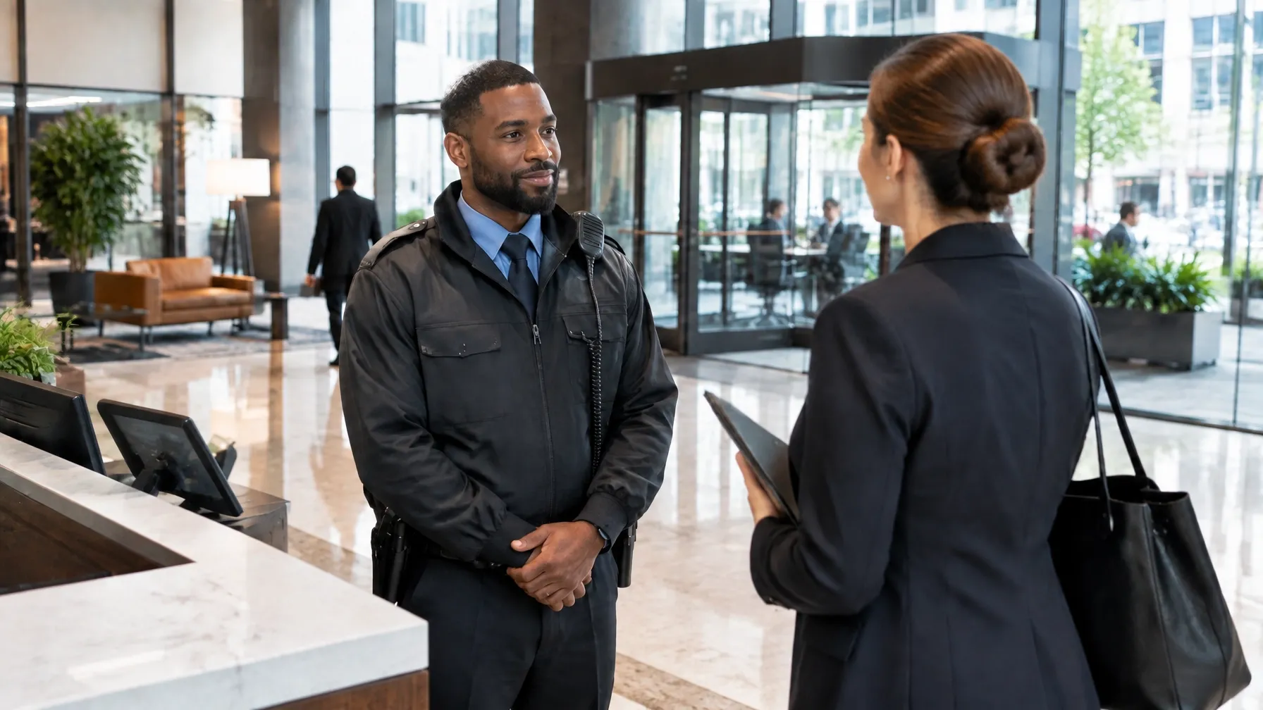 Security officer monitoring visitors at a corporate office reception